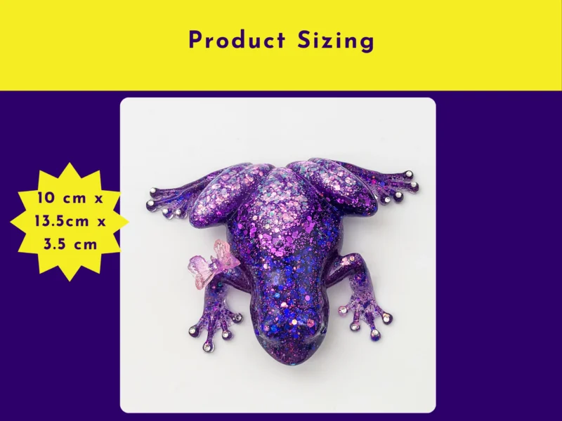 “Purple glitter resin frog shown from above with a butterfly on its back, with a graphic listing size as 10 cm x 13.5 cm x 3.5 cm.”