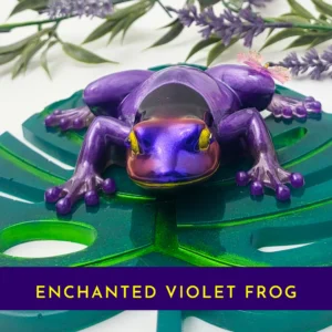 “Purple resin frog with a butterfly on its back on a green leaf base, with a purple banner reading ‘Purple Frog’.”