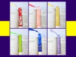 Six personalised glitter resin bookmarks in red, pink, yellow, green, blue and lilac arranged in a neat grid on an open book with matching tassels.