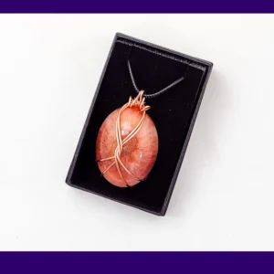 Copper-wire wrapped oval resin pendant in warm autumn tones presented in a black gift box – artisan handmade necklace by Kirnix Creations