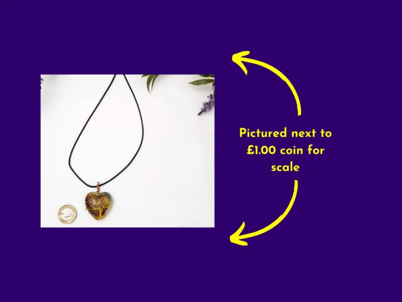 Heart-shaped resin pendant with yellow wire-wrapped tree design shown next to a £1 coin for size comparison – handmade necklace by Kirnix Creations