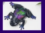Enchanted Prism Frog resin ornament shown from above, with purple lettering on a banner across the image.