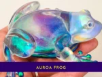 KC-FG-AUR-01 (2) Close-up of the handmade aurora resin frog held in hand to show its colour-shifting detail.