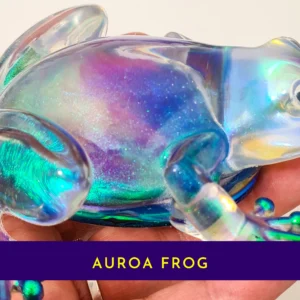 Close-up of the handmade aurora resin frog held in hand to show its colour-shifting detail.
