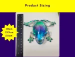 KC-FG-AUR-01 (5) Aurora resin frog shown next to a ruler with measurements 10cm by 13.5cm by 3.5cm.