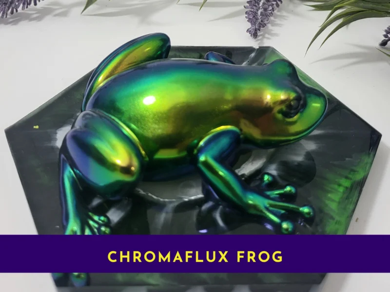 Chrome colour-shift frog on a hex resin base with a purple banner reading ‘Chromaflux Frog