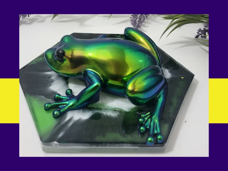 Angled close-up of the Chromaflux Frog showing the high-gloss metallic colour-shift from teal to lime green