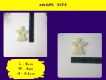 KC-GA 06_Product-Sizing Resin Guardian Angel placed next to a ruler to show horizontal measurement.