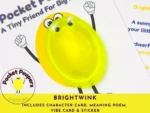 PP-BRI-Primary-Listing-Image Close-up of the Brightwink Pocket Peepers stone attached to its character card, highlighting included sticker and poem card