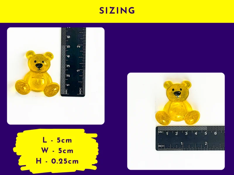 Yellow resin handheld Worry Bear next to ruler with size guide 5 cm by 5 cm, flat pocket pal dimension