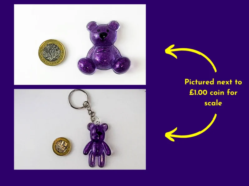 Purple resin Worry Bear handheld and keyring style shown next to £1 coin for size comparison