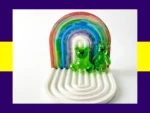 Green resin Worry Bear handheld and keyring pair displayed on white rainbow arch tray – fidget friendly calming bear set