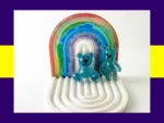 Blue resin Worry Bear handheld and keyring pair displayed on white rainbow arch tray – anxiety calming bears