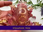 Closeup of steampunk frog showing embedded gears and metallic detailing.