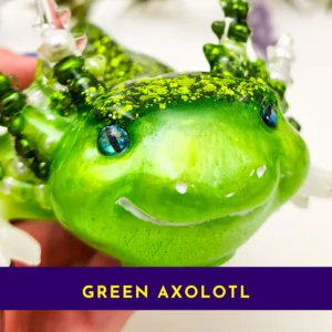 Close-up of green resin axolotl face showing shimmer and blue eyes.