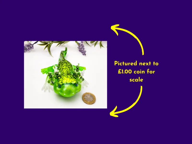 Green resin axolotl next to a £1 coin showing size comparison.