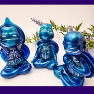 “OOAK blue Zen turtle trio displayed together in outdoor-style foliage background, showing metallic resin shine.”