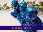 “Title card showing the blue Zen turtle trio in a metallic Spoxy resin finish with the text ‘Blue Zen Turtles.’”