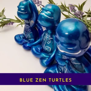 “Title card showing the blue Zen turtle trio in a metallic Spoxy resin finish with the text ‘Blue Zen Turtles.’”