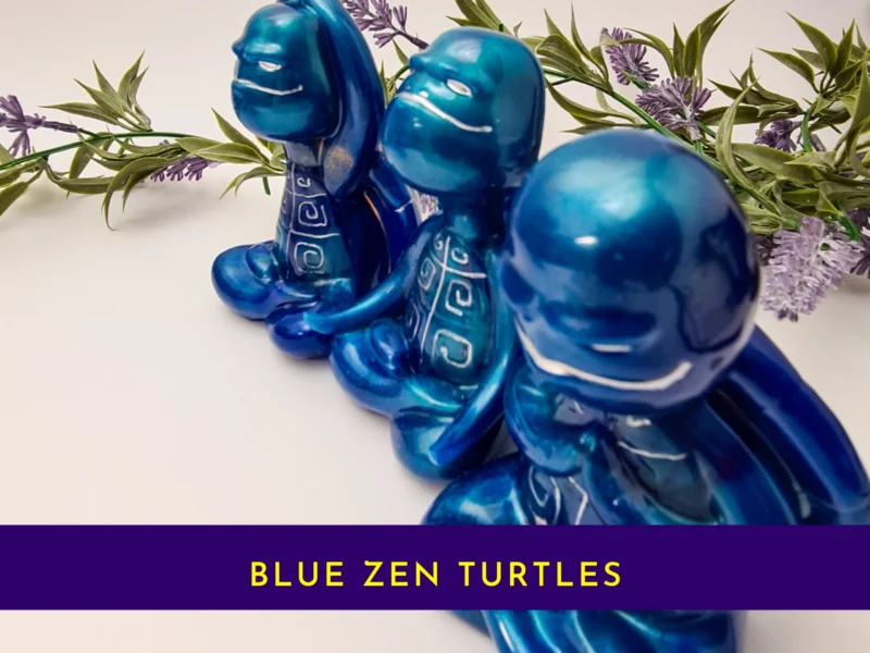 “Title card showing the blue Zen turtle trio in a metallic Spoxy resin finish with the text ‘Blue Zen Turtles.’”