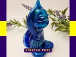 “Front-facing Stretch Pose Zen turtle with raised arms and metallic blue resin colouring.”