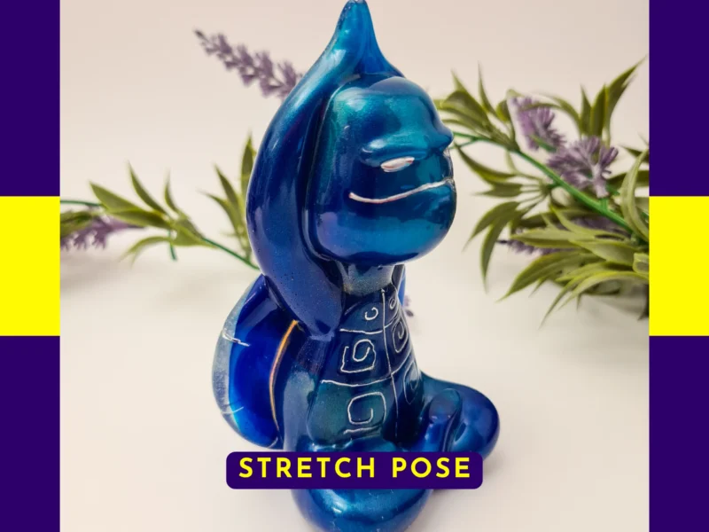 “Front-facing Stretch Pose Zen turtle with raised arms and metallic blue resin colouring.”