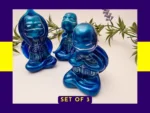 “OOAK resin turtle set shown together in Meditation, Calming and Stretch poses with a metallic blue finish.”