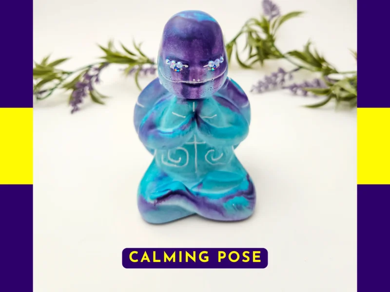 “Front-facing hero shot of the Calming Pose Aqua Zen Turtle with purple facial shading, aqua body and swirling resin pattern.”