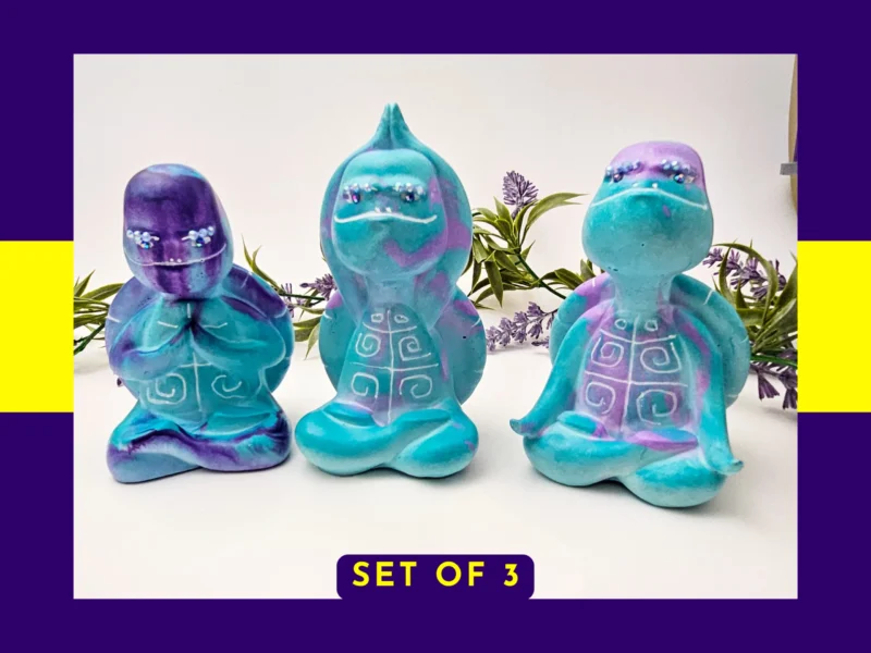 “Aqua Zen Turtle Trio shown together in their Meditation, Calming and Stretch poses with a ‘Set of 3’ label on a purple background.”