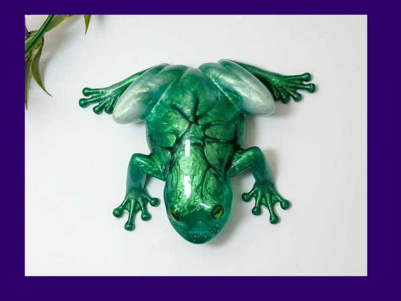 KC-FG-EMRFROG-OOAK012. Kirnix Listing Primary “Top-down view of the OOAK green crackle resin frog displaying emerald crackle pattern and silver highlights.”