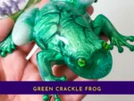 KC-FG-EMRFROG-OOAK013. Kirnix Listing with banner “Handheld view of the OOAK green crackle resin frog showing detailed crackle texture and glossy finish.”