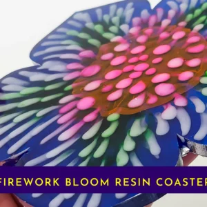“Close-up view of the firework bloom resin coaster showing layered pink, green and white petal details.”