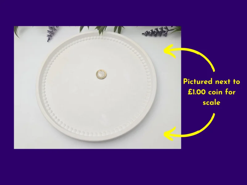 Pearl Rim Round Tray pictured with a £1 coin in the centre to show scale; text callout on the right.