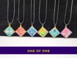 OOO-UVR-001_003 Row of six one-of-one resin pendant necklaces with “ONE OF ONE” text banner underneath.