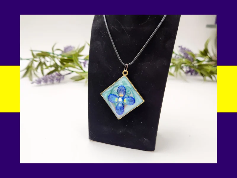 Grid collage showing six different one-of-one resin pendant necklaces on black stands.