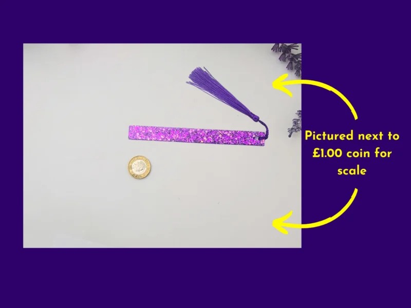Purple glitter bookmark and tassel beside a coin for scale, with arrows showing the coin reference.