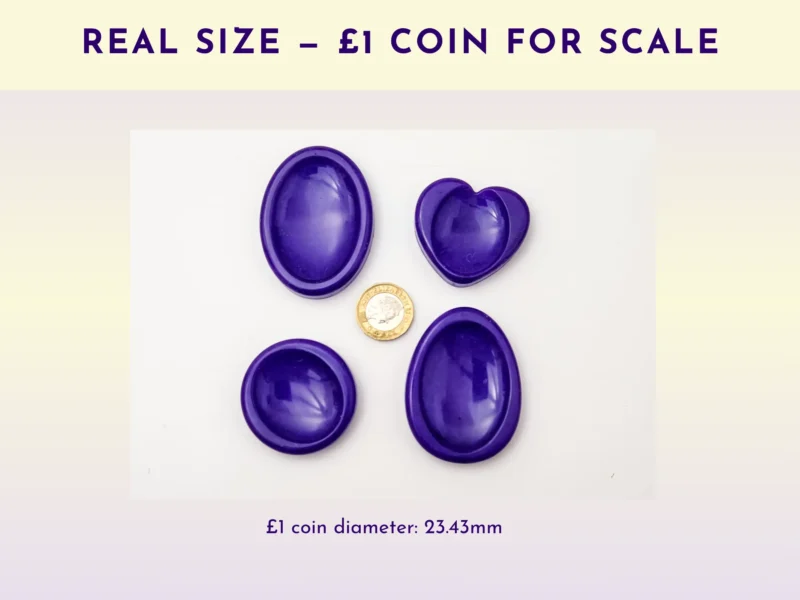 Resin worry stones shown beside a £1 coin for real-size scale reference.