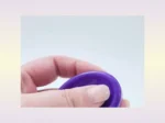 Video cover image showing a purple resin worry stone held between fingers to demonstrate size, finish, and hand feel.