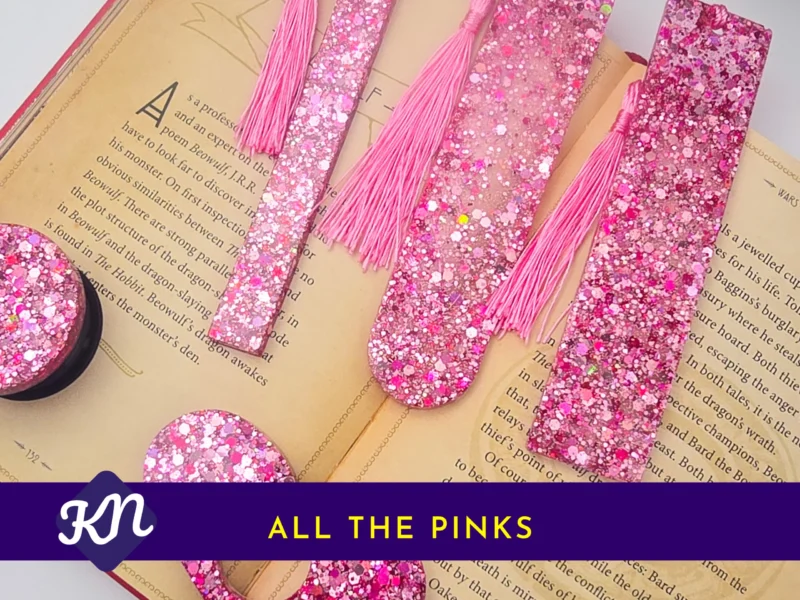 “All the Pinks” hero image showing the full pink glitter set on an open book with banner text.