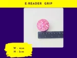E-reader grip size graphic showing round pink glitter e-reader grip next to rulers (labelled “E-reader Grip”).