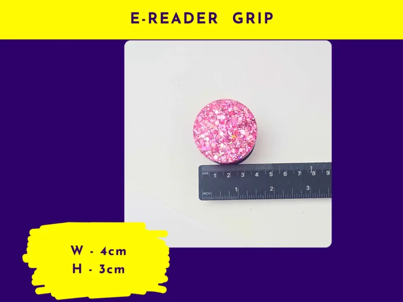 E-reader grip size graphic showing round pink glitter e-reader grip next to rulers (labelled “E-reader Grip”).