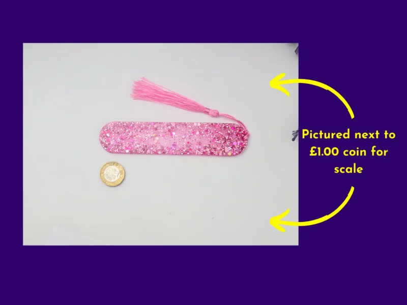 Pink glitter bookmark beside a coin for scale, with arrows highlighting the coin size reference.
