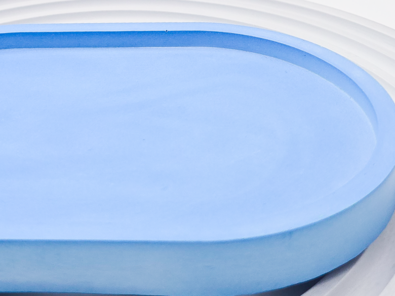 Image 10: Close-up of a pale blue small oval tray edge and smooth finish