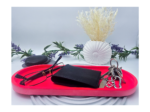 RED extra large oval catchall tray holding keys and a black wallet.