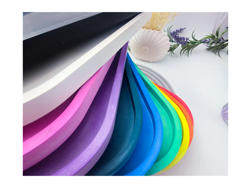Fan stack of oval trays in multiple colours.
