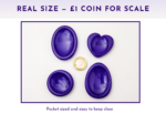 Purple resin worry stones shown beside a £1 coin for size comparison.