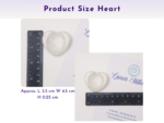 Heart-shaped worry stone shown with ruler measurements on a printed card.