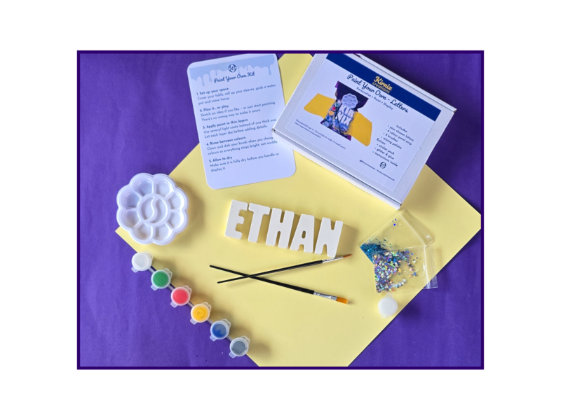 Open personalised paint your own name kit showing Ethan name letters with paints, brush, palette and glitter.