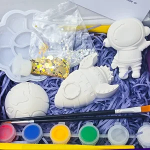 Open box paint your own space kit with astronaut rocket planet paints brushes and glitter