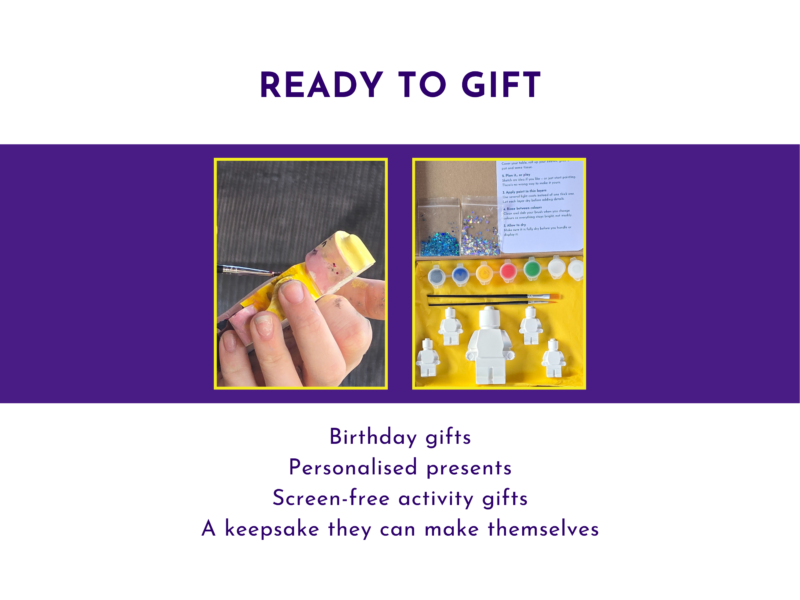 Ready to gift graphic showing a hand holding a painted brick buddy figure beside the boxed kit